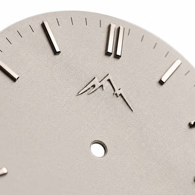 Embossed brand logo on dial