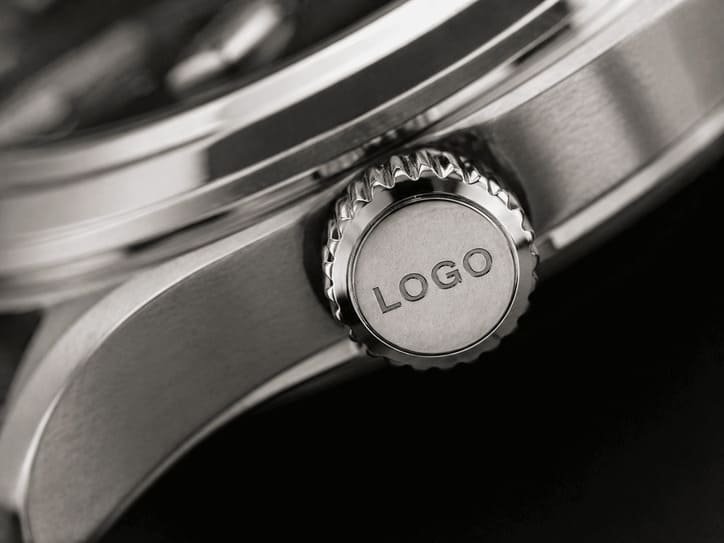 Crown engraving example showing brand initials on watch crown