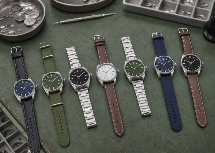 A collection of custom watches with different dials and straps illustrating the concept of watch MOQ.