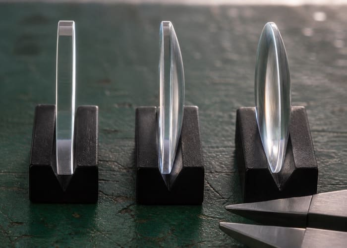 An image illustrating the profile differences between flat, single domed, and double domed sapphire crystal case options.