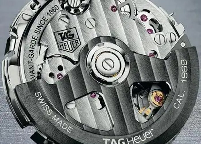 A custom-branded watch rotor with a company logo, a common customization for low MOQ watch movements.